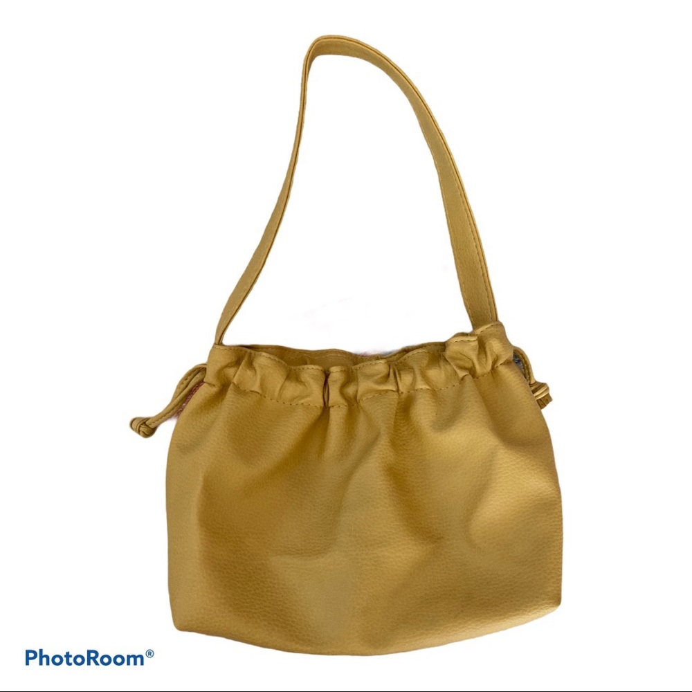 Gold faux leather handbag by L’Oreal Paris.
